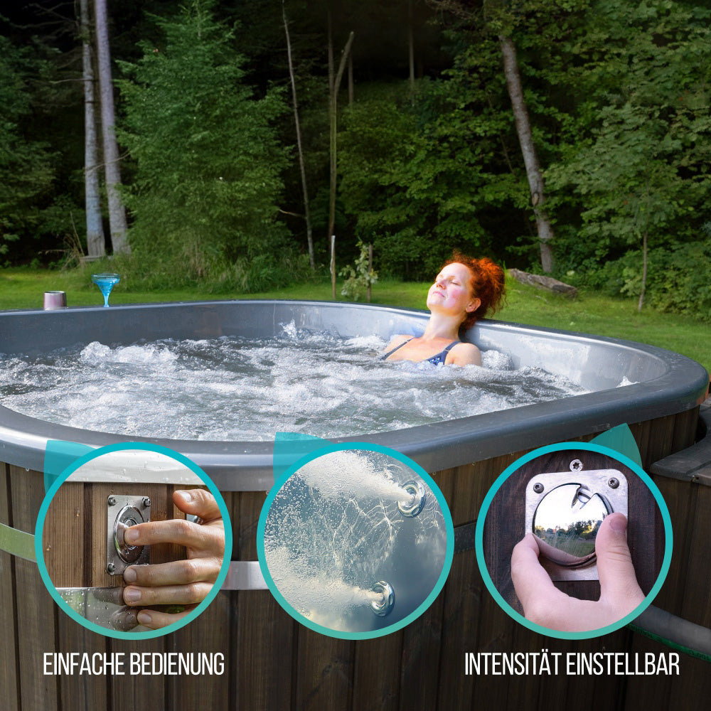A square-shaped wood fired hot tub with metallic insert and a woman relaxing