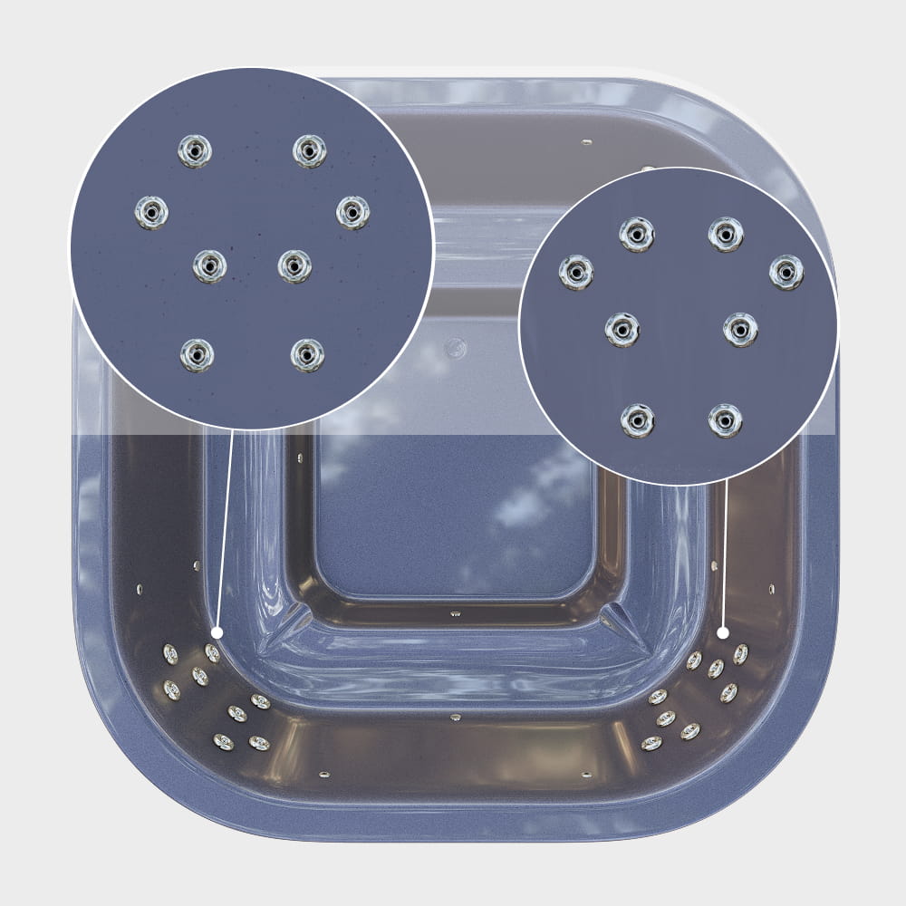 A closer view of the hydro jets in the corners of the gray square hot tub insert—8 jets on each side